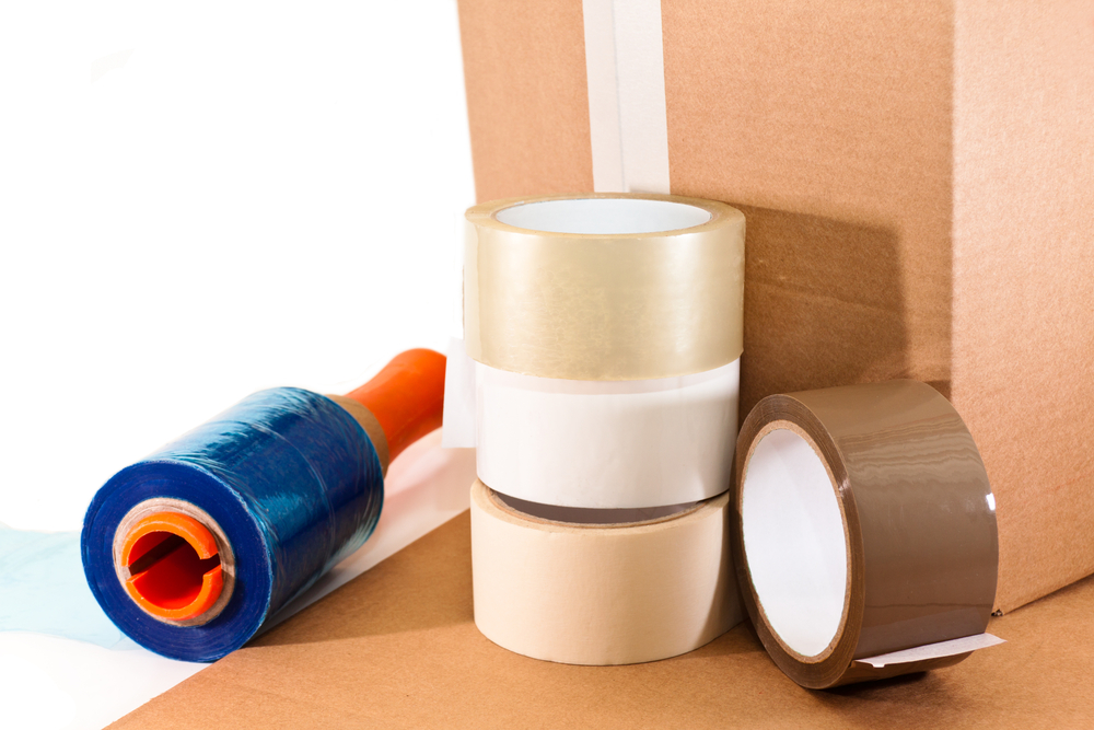 Cardboard,For,Packaging,Adhesive,Tape,And,Nylon,On,White,Background